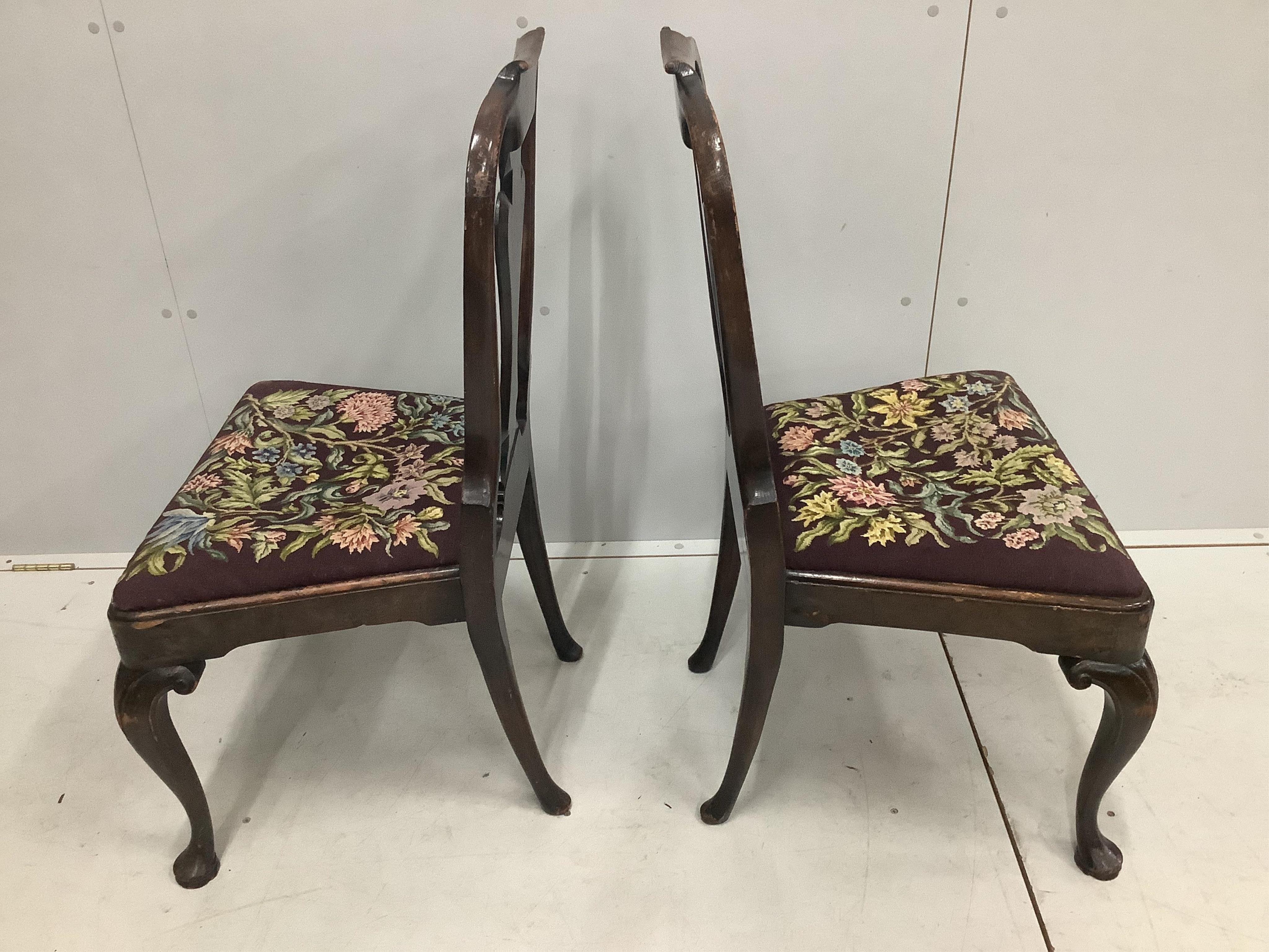 A pair of Queen Anne style walnut dining chairs, height 97cm. Condition - poor